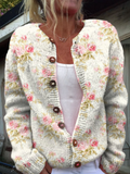 Print met frisse roze bloemen en groene bladeren | Vest met knopen
